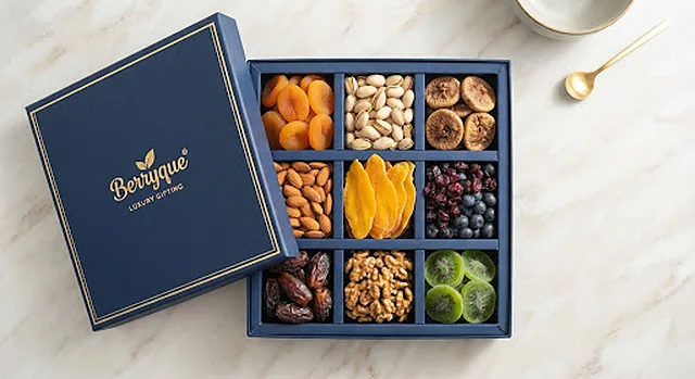 An open compartment box of premium dates, nuts and dried fruit