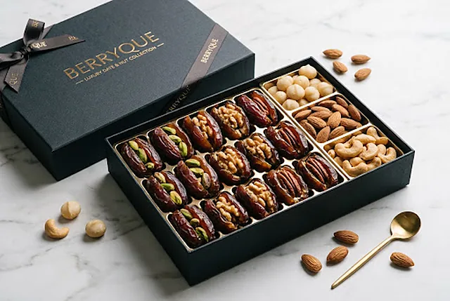 A dark presentation box of dates and pistachios