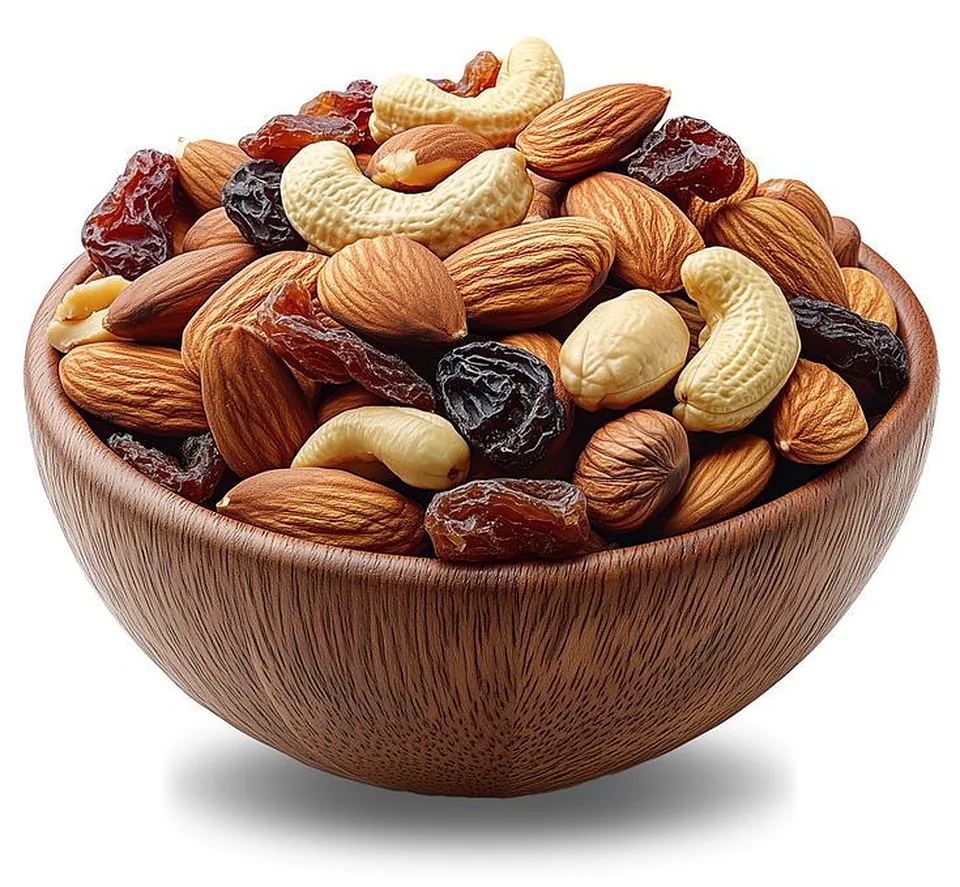 A wooden bowl of almonds, cashews and dried fruit